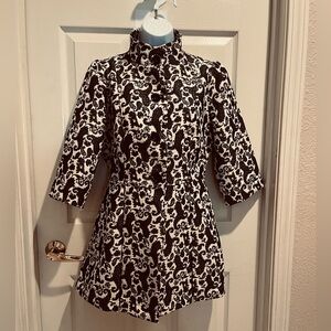 Ethyl cream and black coat